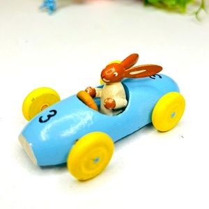 Kitschy Vintage Easter Bunny Rabbit in Race Car Erzgebirge German Democratic Rep